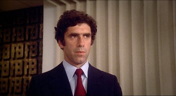 Movie still from “The Silent Partner” (1978), directed by Daryl Duke – A man in a suit and a red tie; Close Up shot, Low angle
