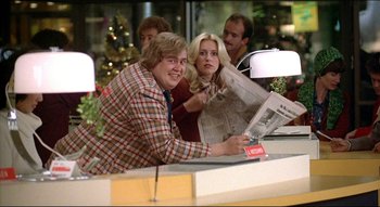 Movie still from “The Silent Partner” (1978), directed by Daryl Duke – A man and a woman sitting in front of a window; Medium shot, Low angle