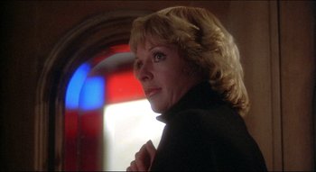 Movie still from “The Silent Partner” (1978), directed by Daryl Duke – A person wearing a black jacket; Close Up shot, Low angle