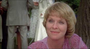 Movie still from “The Silent Partner” (1978), directed by Daryl Duke – A person wearing a pink shirt; Close Up shot, Low angle