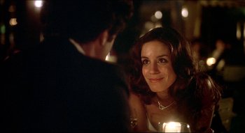 Movie still from “The Silent Partner” (1978), directed by Daryl Duke – A man and a woman sitting at a dinner table; Close Up shot, Over the shoulder angle