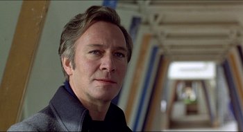 Movie still from “The Silent Partner” (1978), directed by Daryl Duke – A person wearing a jacket; Close Up shot, Low angle