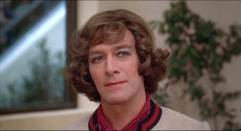 Movie still from “The Silent Partner” (1978), directed by Daryl Duke – A person wearing a sweater; Close Up shot, Over the shoulder angle