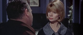 Movie still from “The Skull” (1965), directed by Freddie Francis – A man and a woman talking to each other; Close Up shot, Over the shoulder angle