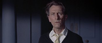 Movie still from “The Skull” (1965), directed by Freddie Francis – A person wearing a neck tie; Close Up shot, Low angle