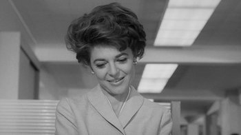 Movie still from “The Slender Thread” (1965), directed by Sydney Pollack – A black and white photo of a woman in a suit; Close Up shot, Low angle