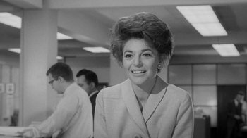 Movie still from “The Slender Thread” (1965), directed by Sydney Pollack – An old black and white photo of a woman smiling; Close Up shot, Low angle