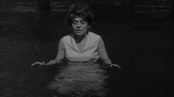 Movie still from “The Slender Thread” (1965), directed by Sydney Pollack – A black and white photo of a woman in the water; Medium shot, High angle