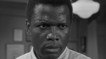 Movie still from “The Slender Thread” (1965), directed by Sydney Pollack – A black and white photo of a man's face; Close Up shot, High angle
