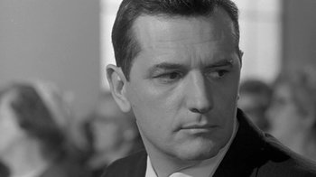 Movie still from “The Slender Thread” (1965), directed by Sydney Pollack – Black and white photograph of a man in a business suit; Close Up shot, Low angle