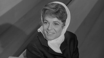 Movie still from “The Slender Thread” (1965), directed by Sydney Pollack – Black and white photograph of a woman wearing a headscarf; Close Up shot, Low angle