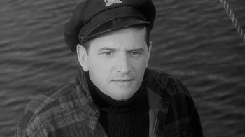 Movie still from “The Slender Thread” (1965), directed by Sydney Pollack – Black and white photograph of a man wearing a hat; Close Up shot, High angle