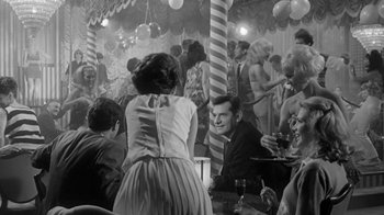 Movie still from “The Slender Thread” (1965), directed by Sydney Pollack – A group of people sitting at tables in a room; Medium shot, Over the shoulder angle