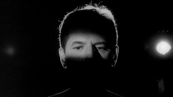 Movie still from “The Slender Thread” (1965), directed by Sydney Pollack – A black and white photo of a man's face; Close Up shot, Low angle