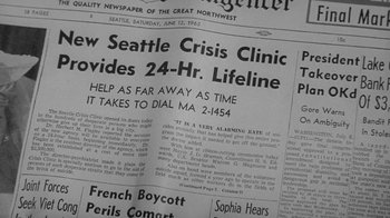 Movie still from “The Slender Thread” (1965), directed by Sydney Pollack – An old newspaper with the headline " new seattle crisis clinic provides 2 4 - hr; Extreme Close Up shot, High angle