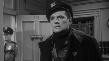 Movie still from “The Slender Thread” (1965), directed by Sydney Pollack – A black and white photo of a man wearing a hat; Close Up shot, Low angle