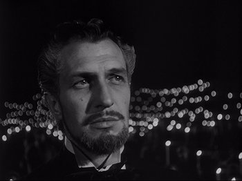 Movie still from “The Song of Bernadette” (1943), directed by Henry King – A black and white photo of a man with a beard; Close Up shot, Low angle
