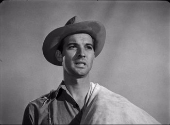 Movie still from “The Southerner” (1945), directed by Jean Renoir – A man wearing a cowboy hat and a scarf around his neck; Close Up shot, Low angle