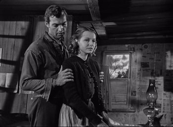 Movie still from “The Southerner” (1945), directed by Jean Renoir – A man and a woman standing next to each other in a room; Medium shot, Low angle