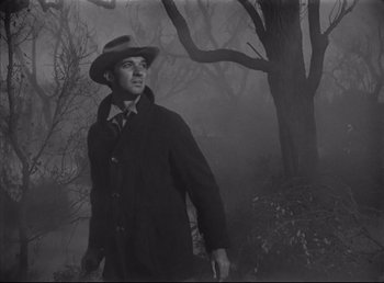 Movie still from “The Southerner” (1945), directed by Jean Renoir – A black and white photo of a man in a hat; Medium shot, Low angle