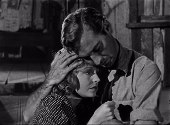 Movie still from “The Southerner” (1945), directed by Jean Renoir – A man and a woman embracing each other in a black and white photo; Close Up shot, Low angle