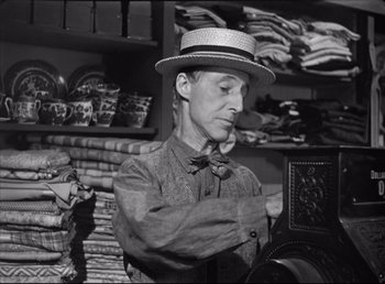 Movie still from “The Southerner” (1945), directed by Jean Renoir – A black and white photo of a man wearing a hat; Medium shot, Low angle
