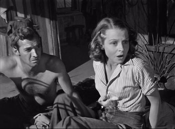 Movie still from “The Southerner” (1945), directed by Jean Renoir – A man and a woman sitting next to each other; Medium shot, Low angle