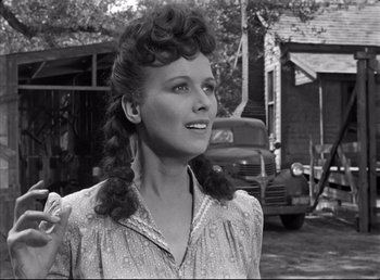 Movie still from “The Southerner” (1945), directed by Jean Renoir – An old photo of a woman in a dress; Close Up shot, Low angle