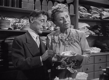 Movie still from “The Southerner” (1945), directed by Jean Renoir – An older man and a woman in a room; Medium shot, Low angle