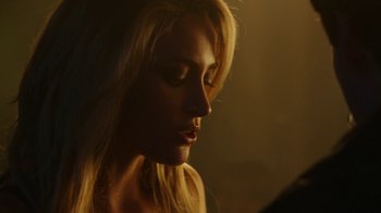 Movie still from “The Space Between” (2021), directed by Rachel Winter – A beautiful blonde woman with long hair; Close Up shot, Over the shoulder angle
