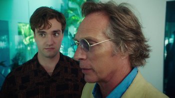 Movie still from “The Space Between” (2021), directed by Rachel Winter – A man with glasses is looking at another man with glasses; Close Up shot, Over the shoulder angle