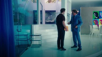 Movie still from “The Space Between” (2021), directed by Rachel Winter – Two men standing next to each other in a room; Wide shot, Over the shoulder angle
