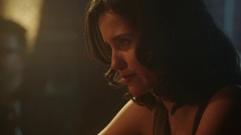 Movie still from “The Space Between” (2021), directed by Rachel Winter – A person wearing a neck tie; Close Up shot, Over the shoulder angle