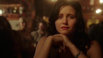 Movie still from “The Space Between” (2021), directed by Rachel Winter – A person with her hand on her chin; Close Up shot, Over the shoulder angle