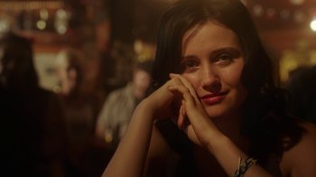 Movie still from “The Space Between” (2021), directed by Rachel Winter – A beautiful young lady sitting at a table; Close Up shot, Over the shoulder angle