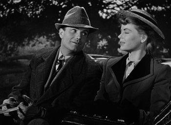 Movie still from “The Spiral Staircase” (1946), directed by Robert Siodmak – A man and a woman sitting next to each other; Medium shot, Low angle