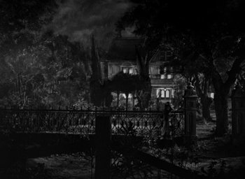 Movie still from “The Spiral Staircase” (1946), directed by Robert Siodmak – A black and white photo of a house in the dark; Extreme Wide shot, High angle