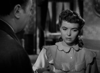 Movie still from “The Spiral Staircase” (1946), directed by Robert Siodmak – An old black and white photo of a man and a woman; Close Up shot, Over the shoulder angle