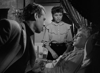 Movie still from “The Spiral Staircase” (1946), directed by Robert Siodmak – A man and a woman standing next to each other; Medium shot, Over the shoulder angle