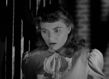 Movie still from “The Spiral Staircase” (1946), directed by Robert Siodmak – A black - and - white photo of a woman with a surprised look on her face; Close Up shot, Low angle