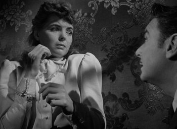 Movie still from “The Spiral Staircase” (1946), directed by Robert Siodmak – An old photo of a woman looking in the mirror; Close Up shot, Over the shoulder angle