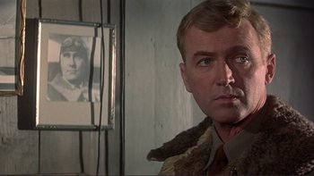 Movie still from “The Spirit of St. Louis” (1957), directed by Billy Wilder – A person with a picture of a person; Close Up shot, Over the shoulder angle