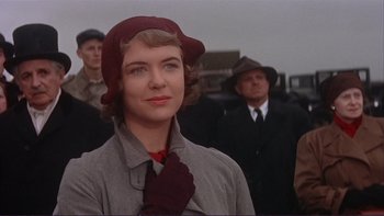 Movie still from “The Spirit of St. Louis” (1957), directed by Billy Wilder – A woman wearing a red hat and a red tie; Close Up shot, Low angle