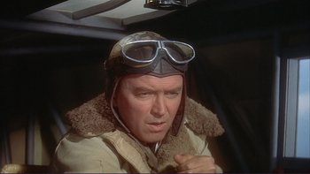 Movie still from “The Spirit of St. Louis” (1957), directed by Billy Wilder – An older man wearing an aviator hat and goggles; Close Up shot, Low angle