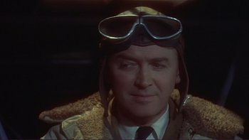 Movie still from “The Spirit of St. Louis” (1957), directed by Billy Wilder – A person wearing a hat and goggles; Close Up shot, Low angle