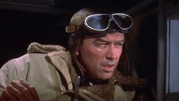Movie still from “The Spirit of St. Louis” (1957), directed by Billy Wilder – An older man wearing a pilot's jacket and goggles; Close Up shot, Low angle