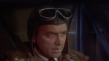 Movie still from “The Spirit of St. Louis” (1957), directed by Billy Wilder – A person wearing a hat and goggles; Close Up shot, Low angle