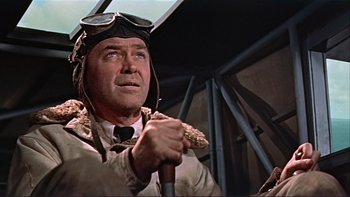 Movie still from “The Spirit of St. Louis” (1957), directed by Billy Wilder – An older man in an old - fashioned pilot's outfit; Medium shot, Low angle
