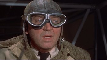 Movie still from “The Spirit of St. Louis” (1957), directed by Billy Wilder – A man wearing a helmet and goggles; Close Up shot, Low angle