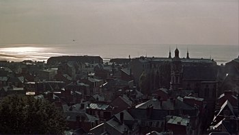 Movie still from “The Spirit of St. Louis” (1957), directed by Billy Wilder – A view of a large city with a view of the ocean; Extreme Wide shot, High angle